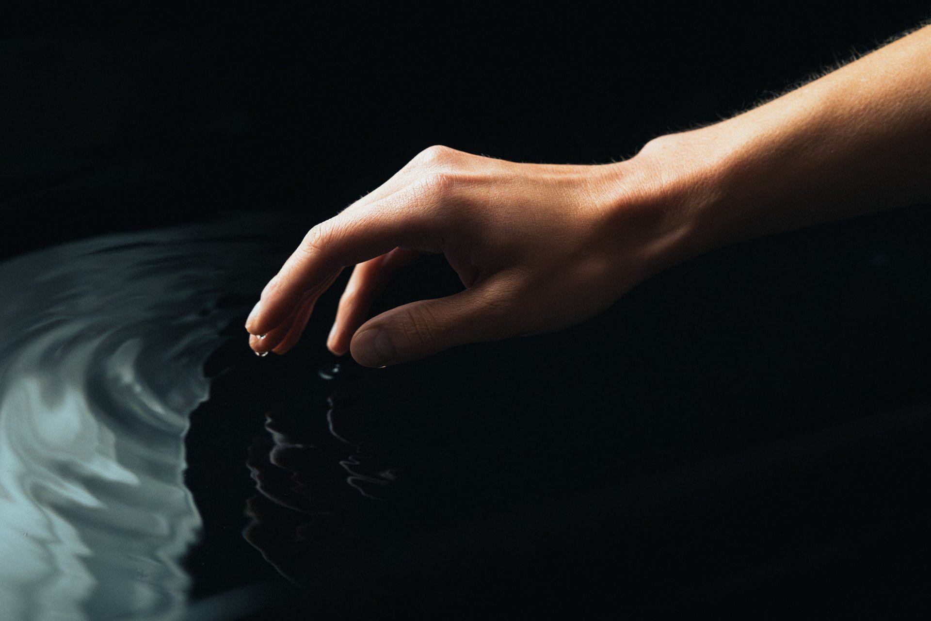 A hand above dark water, from the Tero film